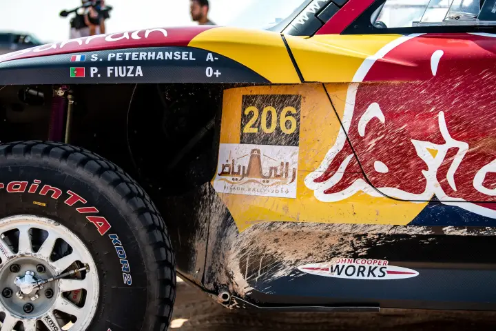 Riyadh Rally 2019: close-up car door panel with sponsors and number